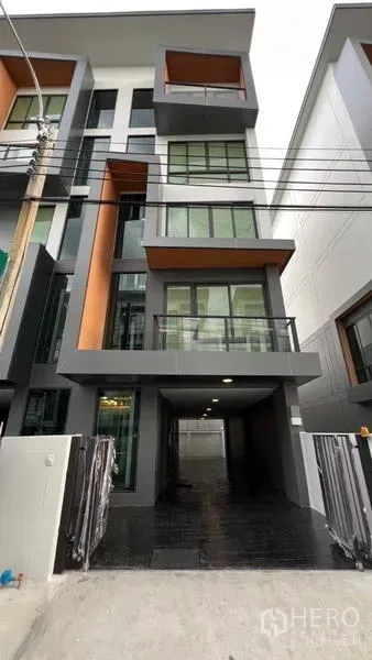 Home Office for rent - Front elevation of the home office again showing balconies and large glazed panels.