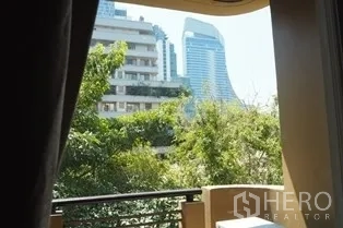 Condominium for rent in Pathum Wan, Bangkok - City and tree-lined view from the condo balcony.