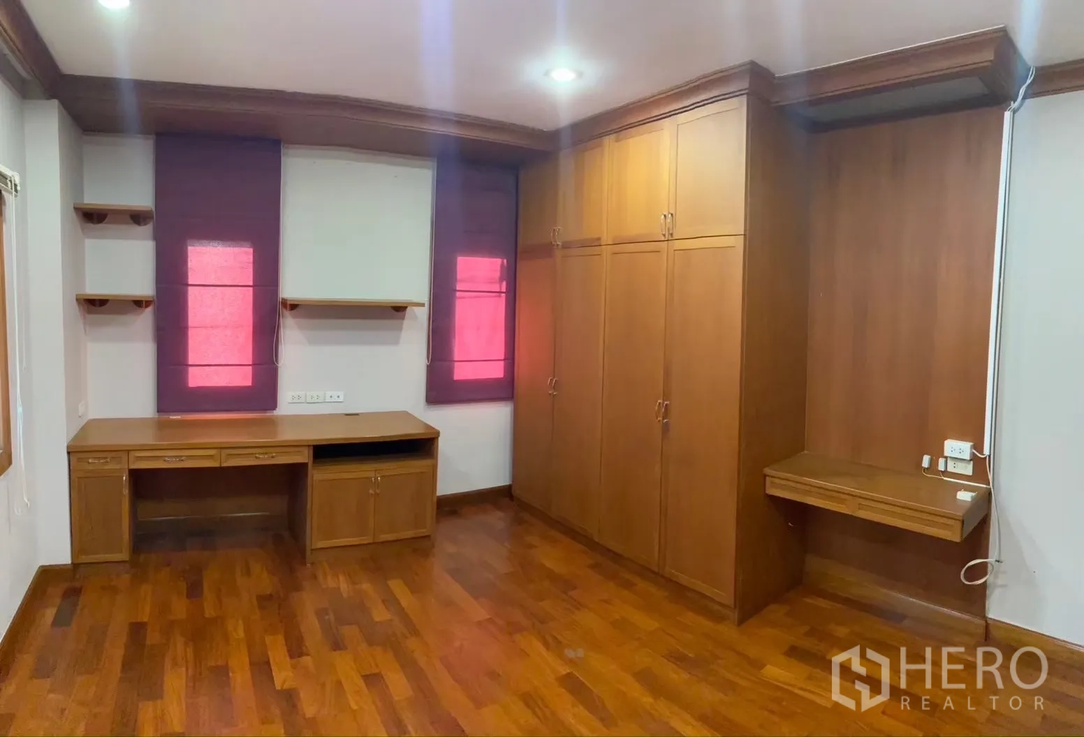 Detached House for rent in Watthana, Bangkok - Wide view of master bedroom showing storage units and balcony access.