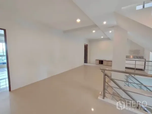 Home Office for rent or sale in Bang Na, Bangkok - Upper floor workspace featuring a built-in pantry and railing overlooking the stairwell.
