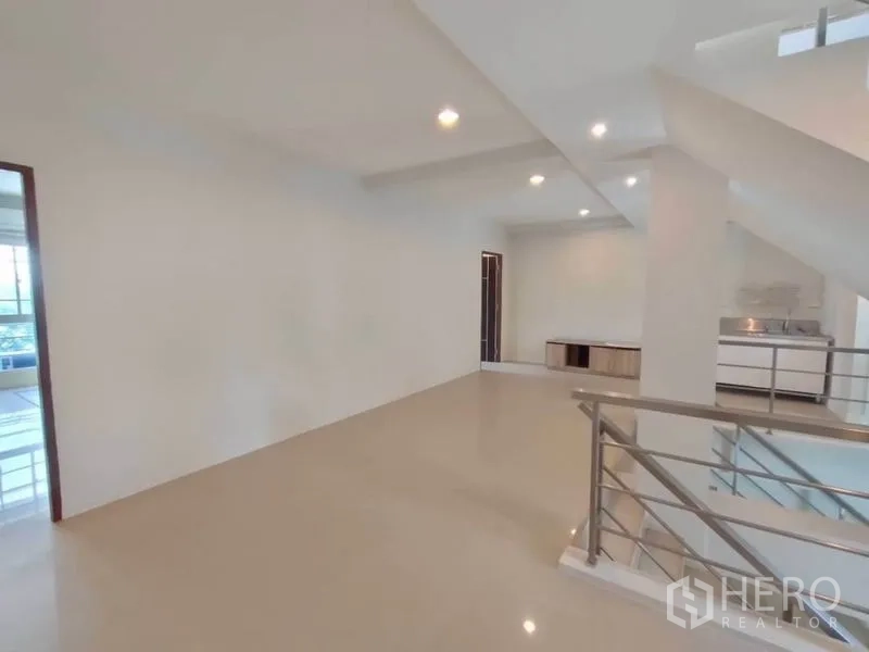 Home Office for rent or sale in Bang Na, Bangkok - Upper floor workspace featuring a built-in pantry and railing overlooking the stairwell.
