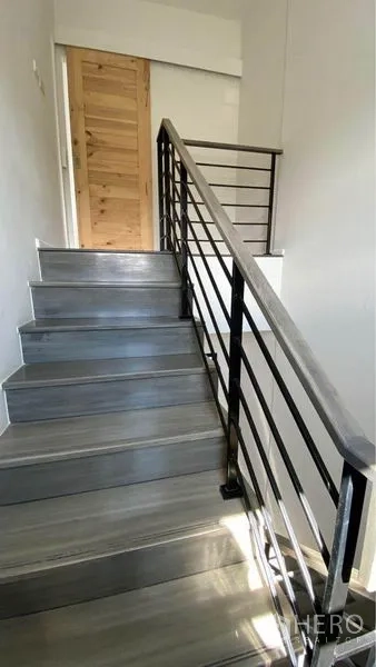 Retail Space for sale in Bang Na, Bangkok - Staircase with metal railing and grey steps leading to the upper level.