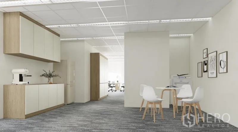 Office Space for rent in Dusit, Bangkok - Pantry and break-out zone with built-in cabinets, coffee machine and round table seating.