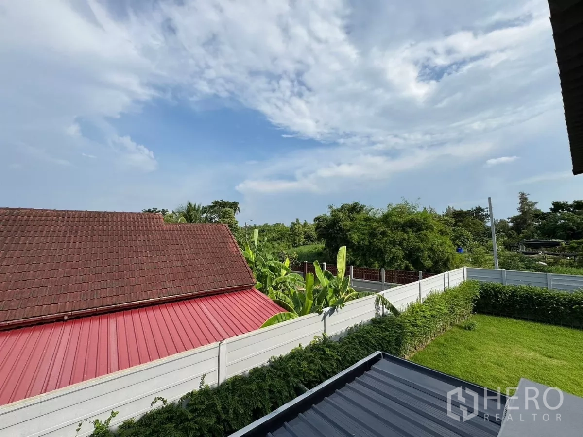 Townhouse for rent in Bang Phli, Samut Prakan - Upper-floor view over green neighborhood and private garden.