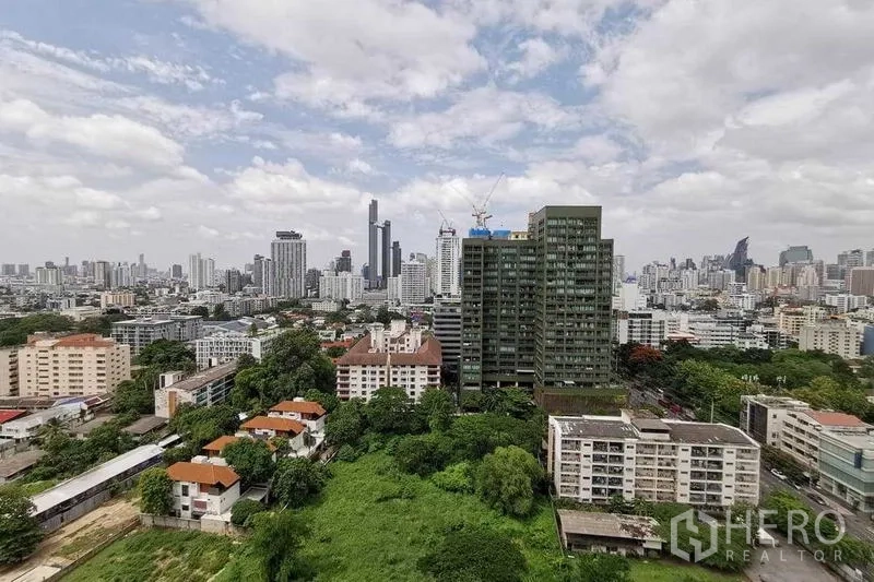 Condominium for rent or sale in Watthana, Bangkok - High-floor city skyline view over Thonglor and surrounding green spaces.