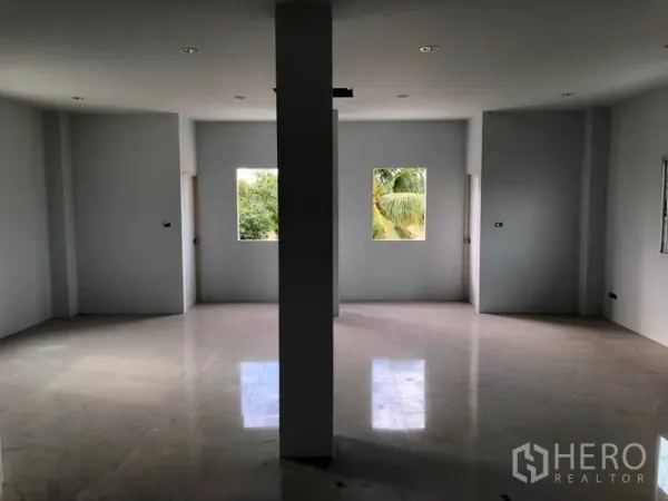 Factory for rent in Khlong Luang, Pathum Thani - Upper-floor office space with glossy tiles and windows overlooking greenery.