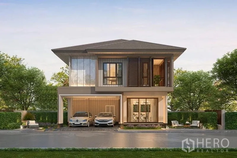 Detached House for sale in Bang Kapi, Bangkok - Front elevation render of a contemporary detached house with two-car carport and landscaped frontage.