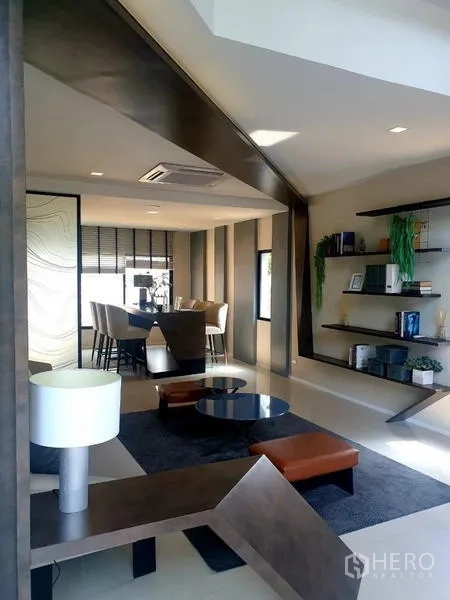 Home Office for rent in Bang Phli, Samut Prakan - Contemporary lounge with seating set, open shelving and accent lighting.