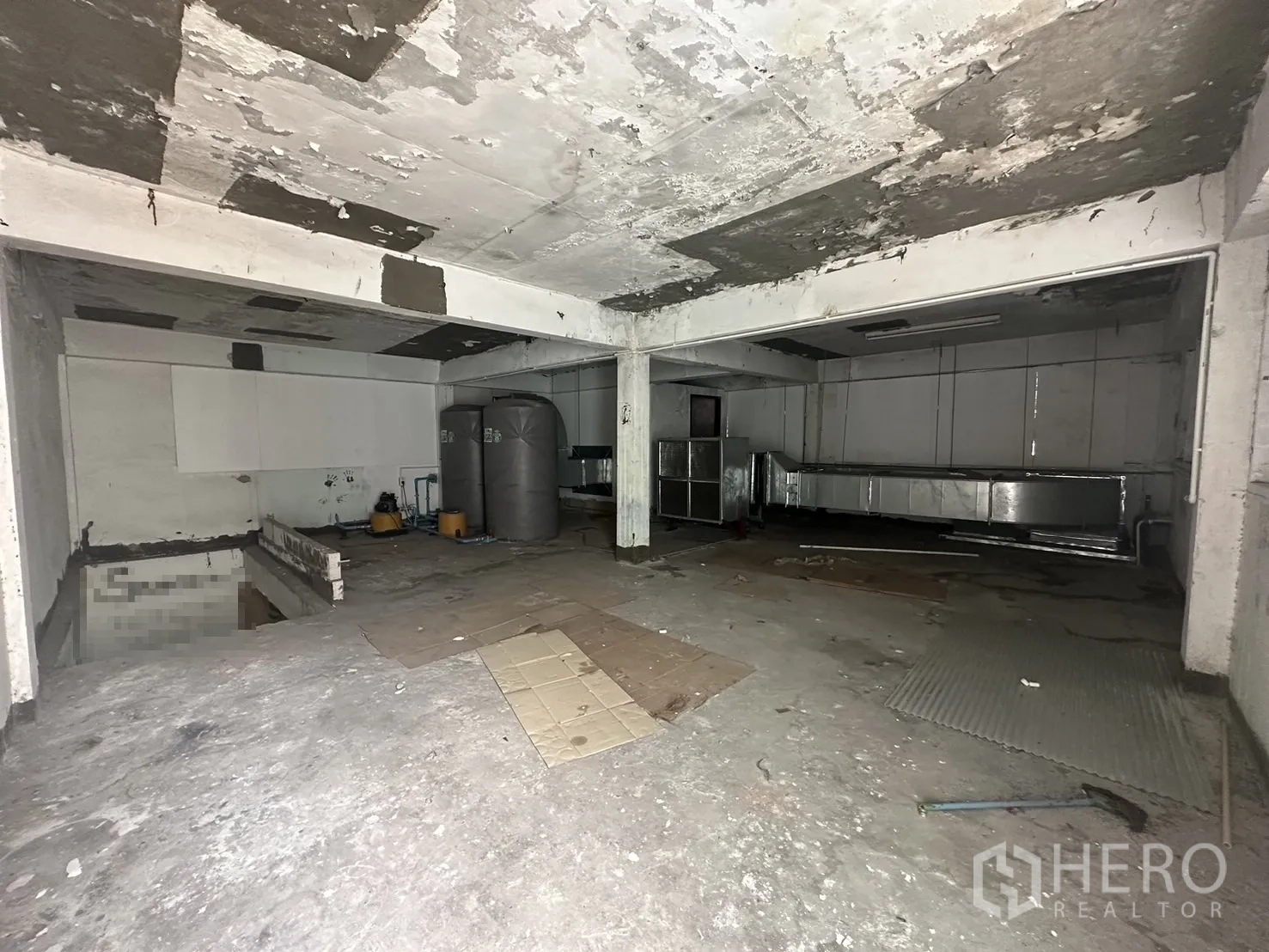 Shophouse for rent in Watthana, Bangkok - Raw concrete storage or basement level with tanks and ductwork.