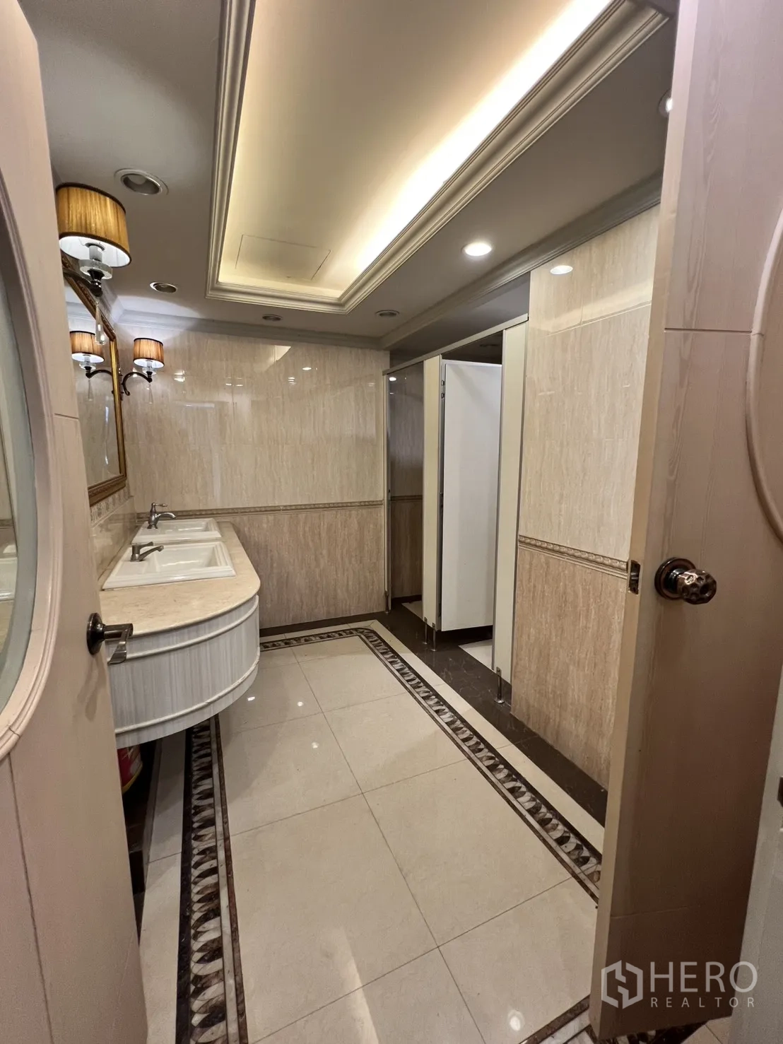 Office Space for rent in Watthana, Bangkok - Restroom with double sinks, mirrors, and soft ceiling lights.