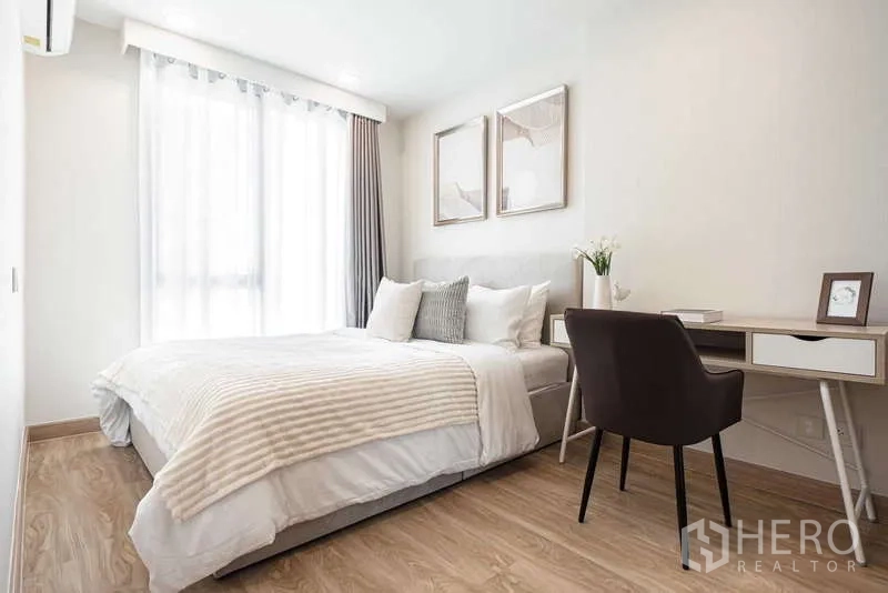 Condominium for rent - Spacious bedroom with large window, work desk and wood floors.