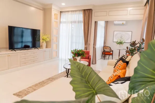 Detached House for rent in Saphan Sung, Bangkok - View to media wall and large windows with sheer curtains flooding light.