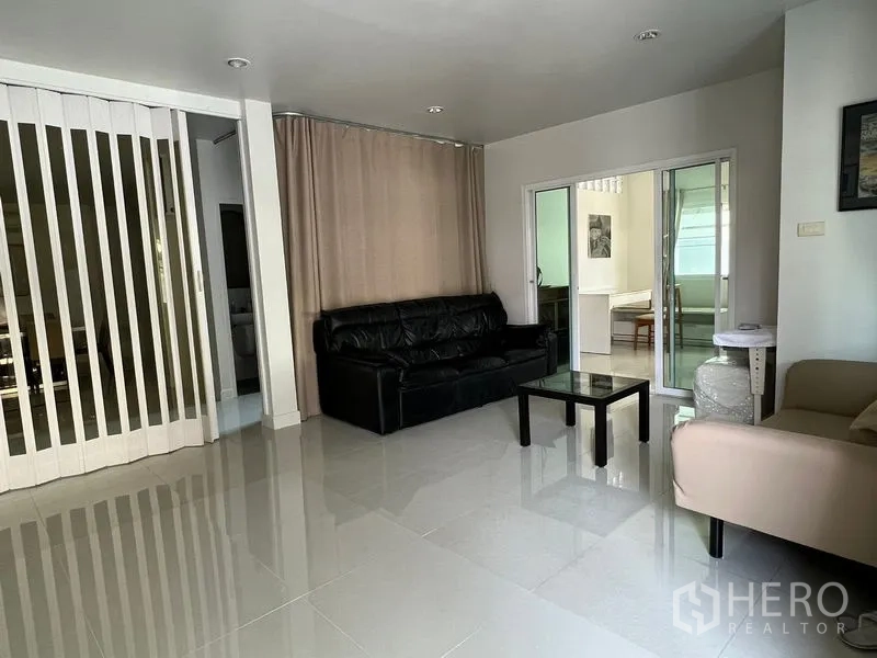 Detached House for rent in Bang Kapi, Bangkok - Two-storey detached house exterior with gated fence and covered carport for two cars.