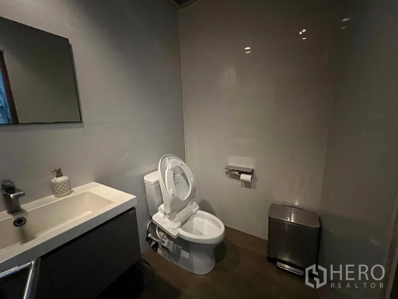 Retail Space for rent in Bang Rak, Bangkok - Clean restroom with vanity sink, toilet, and bin.