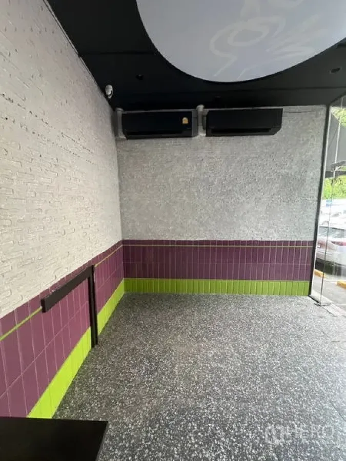 Retail Space for rent in Watthana, Bangkok - Compact retail zone with feature brick wall, corner glazing, and ample natural light.