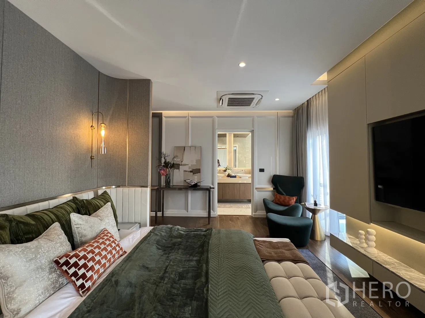 Detached House for sale in Lat Phrao, Bangkok - Master bedroom view toward the ensuite bathroom with soft lighting and large windows.
