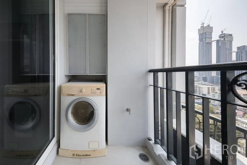 Condominium for rent or sale in Watthana, Bangkok - Private balcony with washing machine and high-rise city views near Thonglor.