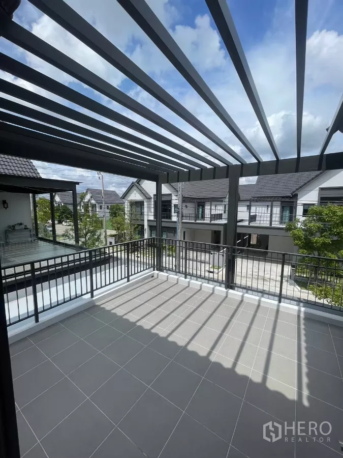 Detached House for rent in Bang Phli, Samut Prakan - Large terrace with pergola shade and neighborhood view.