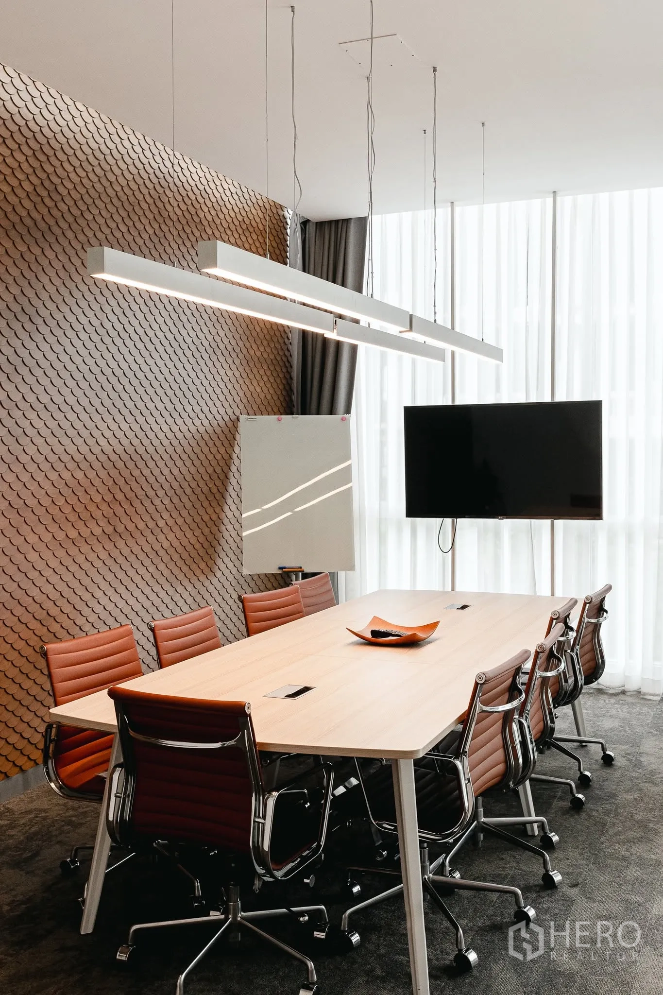 Office Space for rent in Bang Kapi, Bangkok - Executive meeting room with long table, leather chairs, wall feature, and mounted TV display.