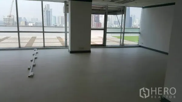 Office Space for rent in Khlong Toei, Bangkok - Wide office area facing a wall of glass and terrace, filled with natural light.
