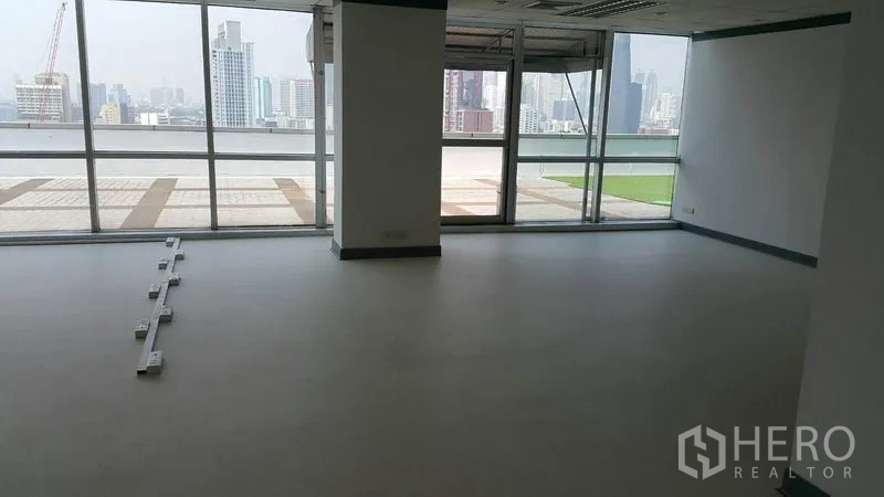 Office Space for rent in Khlong Toei, Bangkok - Wide office area facing a wall of glass and terrace, filled with natural light.