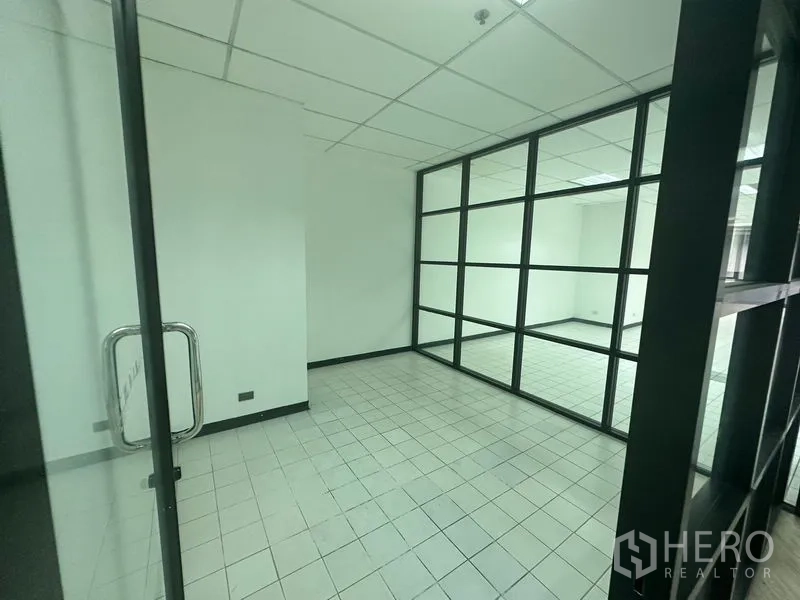 Office Space for rent in Din Daeng, Bangkok - Compact meeting room with black-framed glass walls and tiled floor.