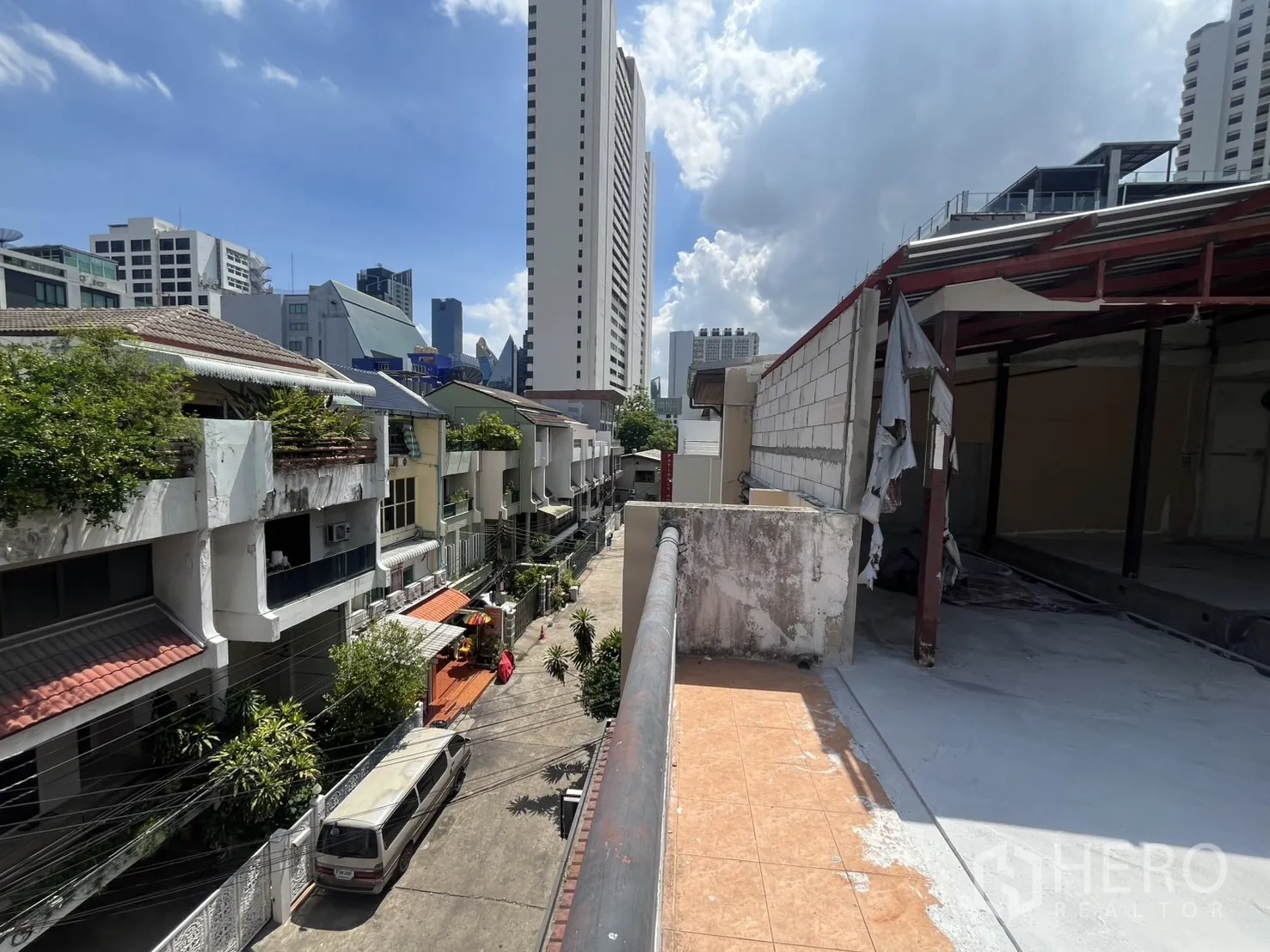 Retail Space for rent in Watthana, Bangkok - Upper-level terrace overlooking a quiet side street with city skyline views.