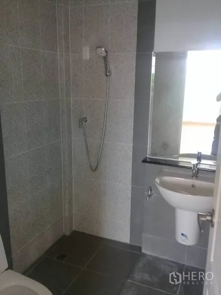 Home Office for rent in Bang Na, Bangkok - Modern bathroom with shower, mirror, and basin finished in gray tiles.