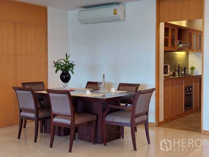 Apartment for rent - Dining area with six-seat table beside the doorway to the kitchen.