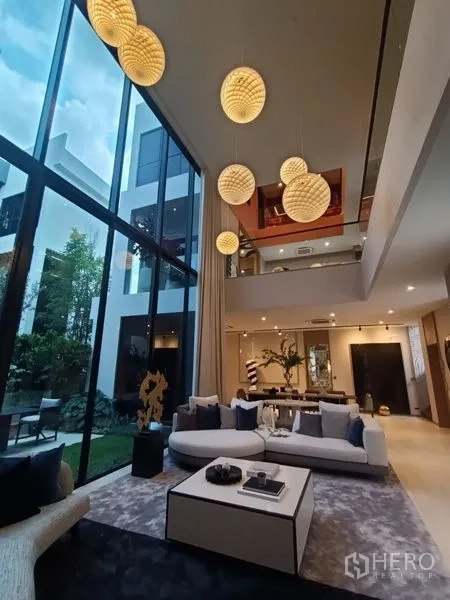 Detached House for sale - Open living area with soaring ceilings, pendant lights and garden outlook.