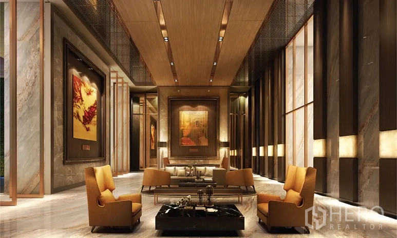 Condominium for sale in Watthana, Bangkok - Grand lobby with high ceiling, marble walls and elegant seating.
