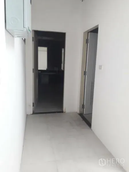 Retail Space for rent in Watthana, Bangkok - Hallway leading to service area and restrooms inside the retail space.