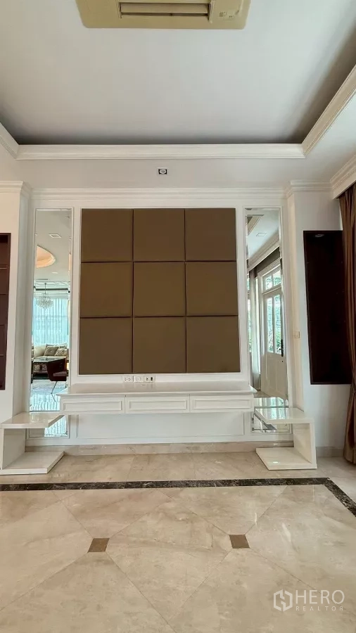 Detached House for rent or sale in Bang Phli, Samut Prakan - TV wall panel and marble flooring in a separate family room