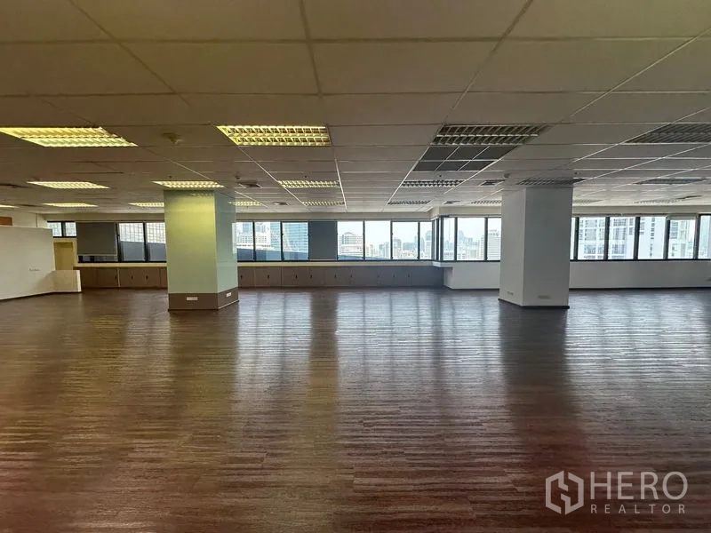 Office Space for rent in Bang Rak, Bangkok - Corner open area with panoramic city views and built-in cabinets under windows.
