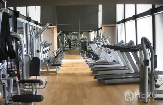 Condominium for rent or sale in Sathon, Bangkok - Fully equipped fitness center with treadmills, weight machines and mirrored walls.