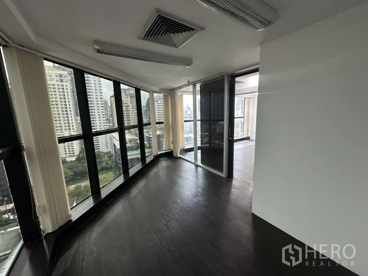 Office Space for rent in Watthana, Bangkok - Wraparound corner room with vertical blinds and sliding doors to the main office.