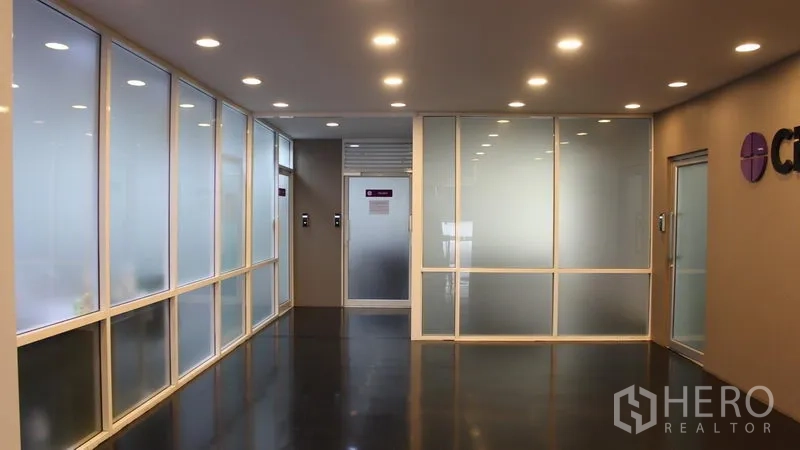 Office Space for rent in Suan Luang, Bangkok - Bright hallway with frosted glass partitions and recessed downlights