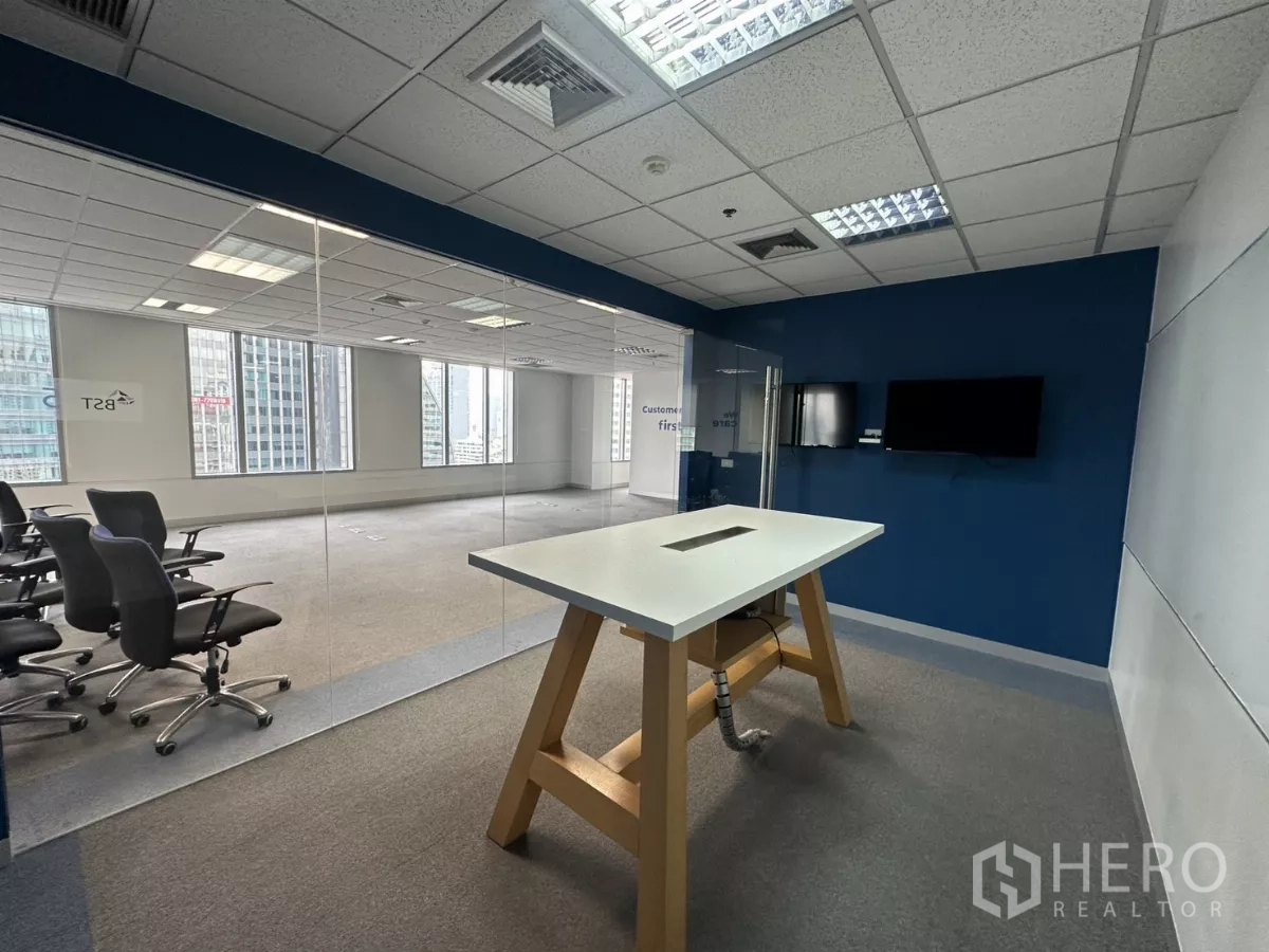 Office Space for rent in Watthana, Bangkok - View from the meeting room through a glass wall to a bright open office.