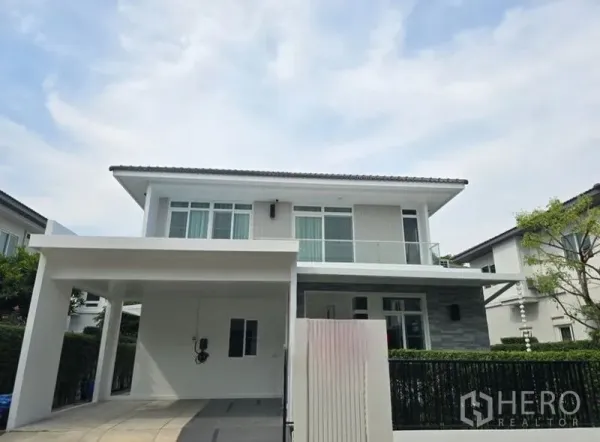 Detached House for rent - Alternate front exterior view showing covered parking and entry gate.