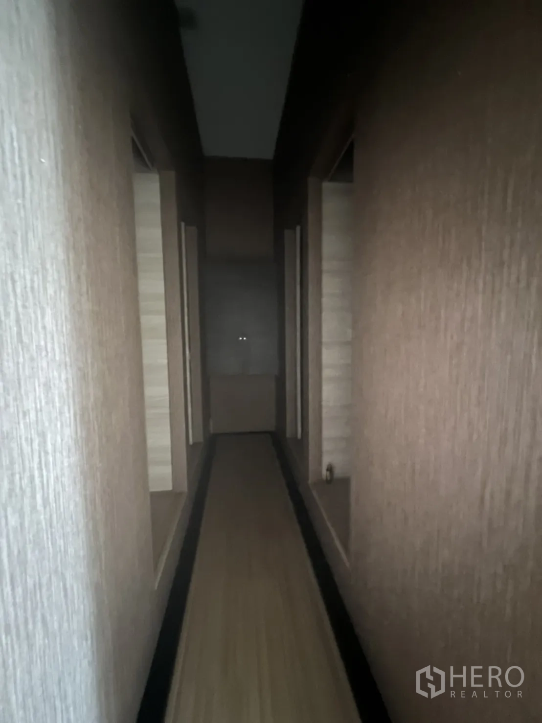 Retail Space for rent in Watthana, Bangkok - Long corridor with multiple room openings and textured wall panels.