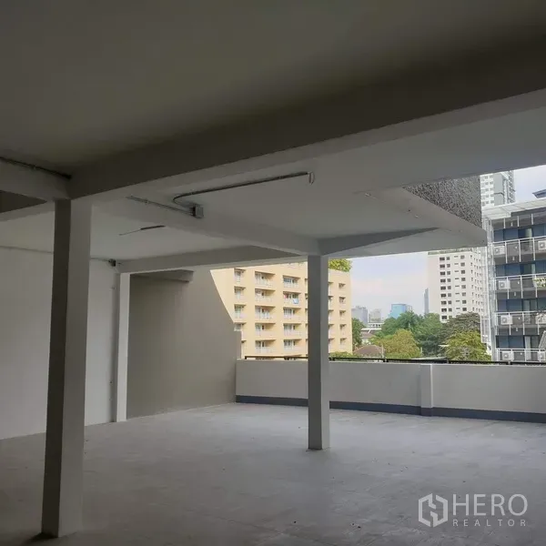 Home Office for rent in Khlong Toei, Bangkok - Large terrace of the home office with partial roof cover overlooking the Bangkok skyline.