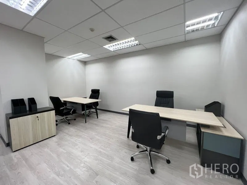 Office Space for rent in Sathon, Bangkok - Furnished private office in Sathon, Bangkok with three desks, black chairs, LED lighting and wood-look flooring.