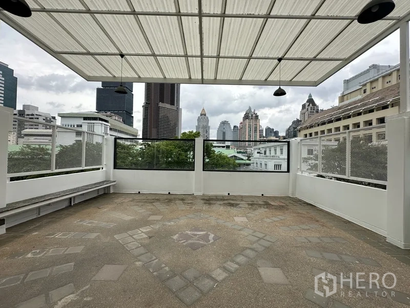 Retail Space for rent in Bang Rak, Bangkok - Terrace under a translucent canopy facing downtown towers.