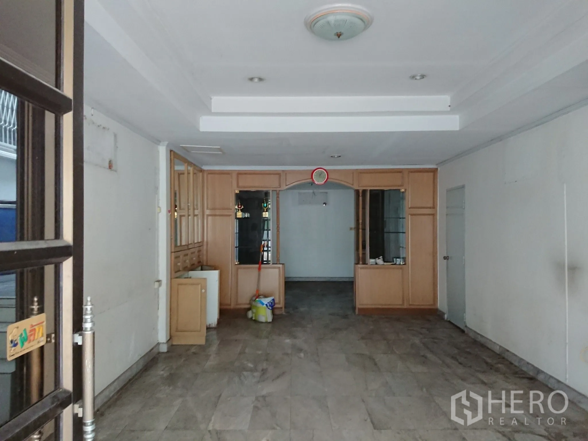 Detached House for sale in Chatuchak, Bangkok - Ground floor room with built-in cabinets and arched detail.