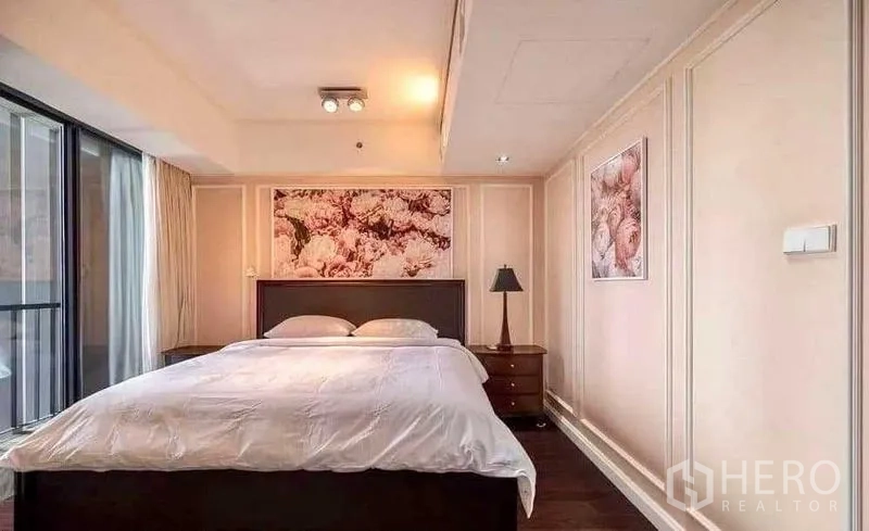 Condominium for rent - Cozy bedroom with artwork and access to the balcony.