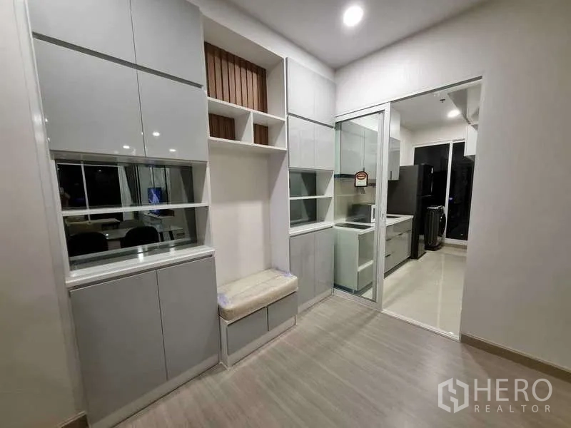 Condominium for rent - Built-in storage wall with glass sliding door connecting to the kitchen.