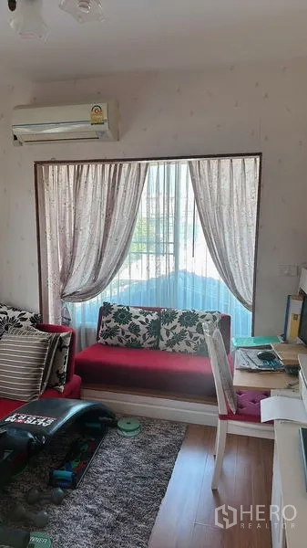 Detached House for rent in Bang Phli, Samut Prakan - Cozy study or sitting room with desk, sofa bench, and a large window.