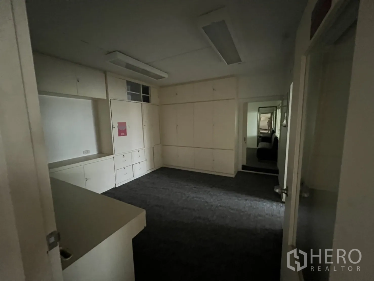 Shophouse for rent or sale in Watthana, Bangkok - Dim office with full-height storage cabinets.