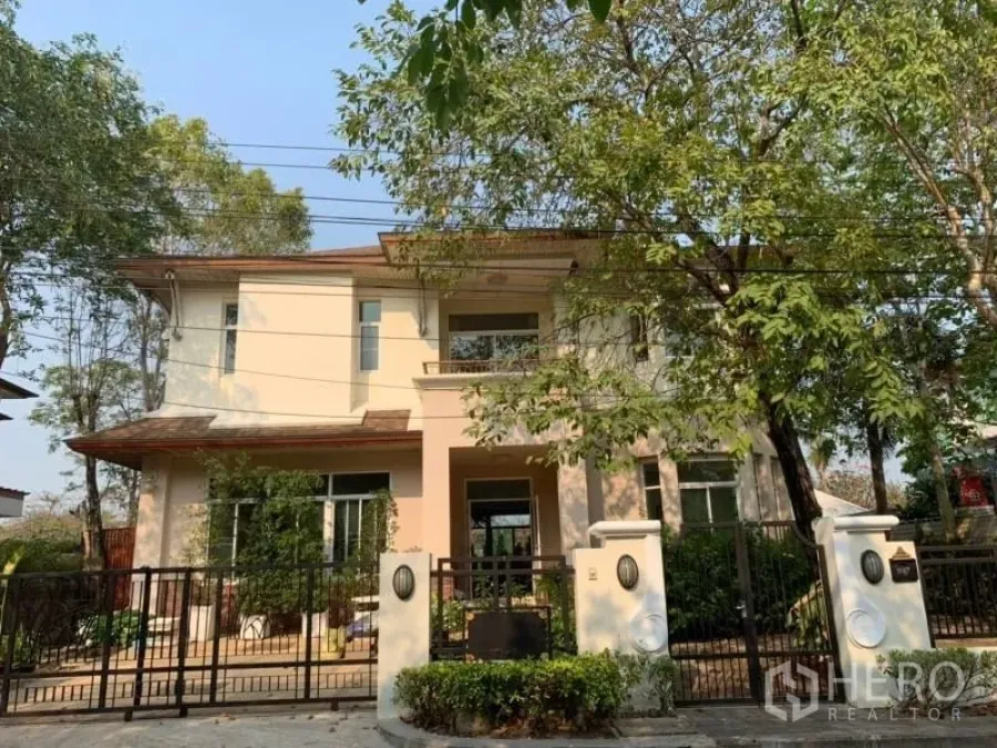 Detached House for rent in Lat Krabang, Bangkok - Two-storey detached house exterior with gated entrance and mature trees.