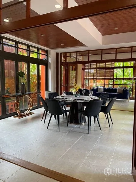 Detached House for rent in Suan Luang, Bangkok - Open layout showing dining zone and sunlit sitting room with garden outlook.